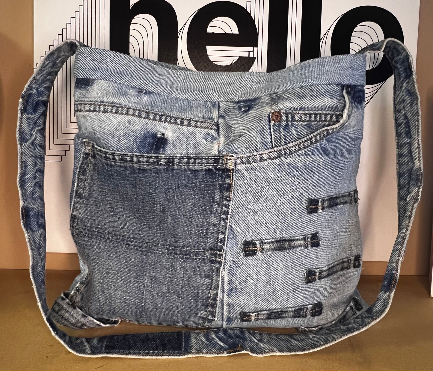 Denim shoulder bag with multi color lining