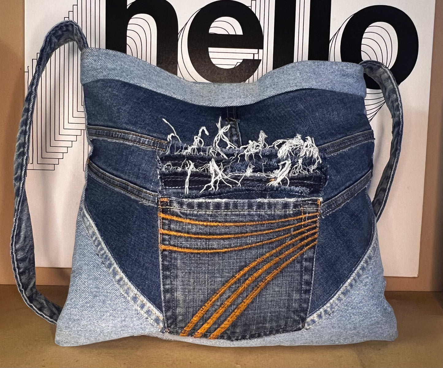 Denim shoulder bag with multi color lining